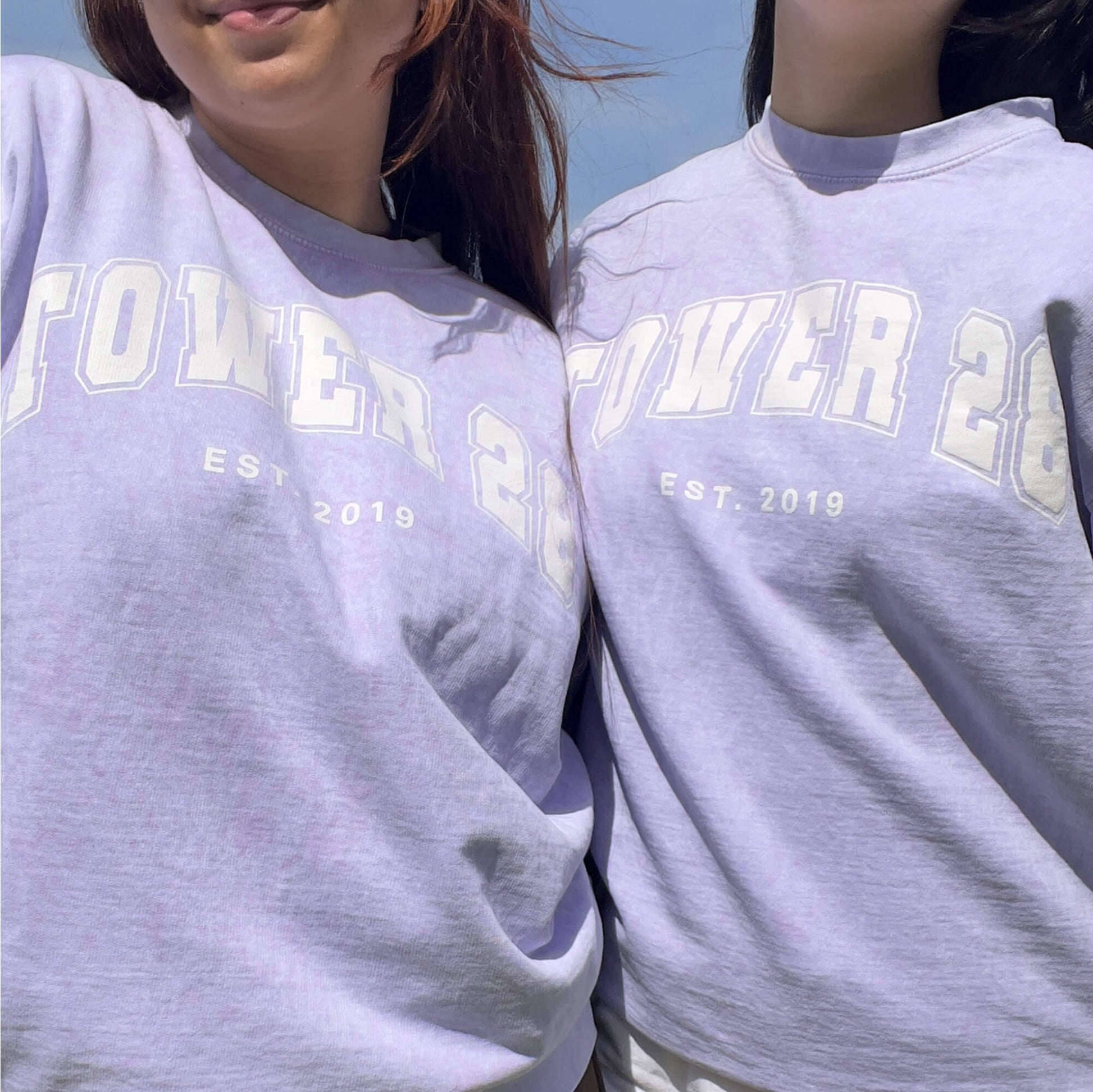 [Shared: Tower 28 Beauty Varsity Crewneck in vintage acid wash purple worn by two models