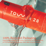 Tower 28 Beauty SOS Daily Rescue Spray bottle splashing in water. Overlaid text: “100% Recycled Packaging – inspired by a lifeguard’s buoy, the bottle is made entirely of PCR aka post-consumer-resin aka recycled plastic.” [Shared]