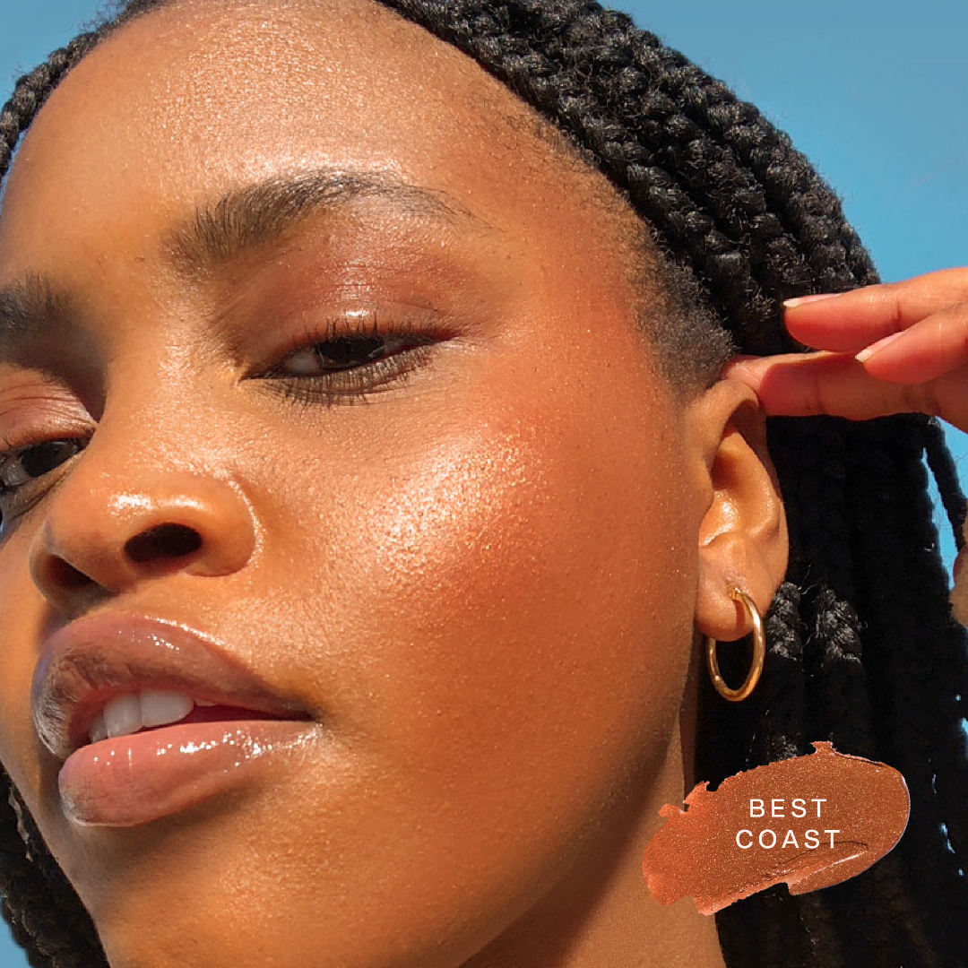 Shade: Best Coast [A close up of a model wearing Tower 28 Beauty's Bronzino™ Cream Bronzer in the shade Best Coast]