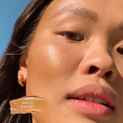 Shade: Gold Coast [A close up of a model wearing Tower 28 Beauty's Bronzino™ Cream Bronzer in the shade Gold Coast]