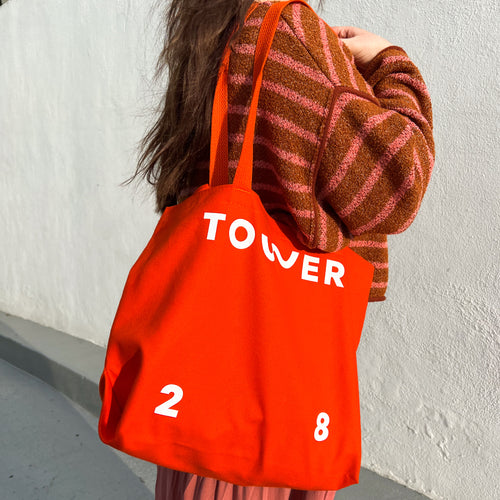 [Shared: The Tower 28 Beauty tote bag being carried on figure]