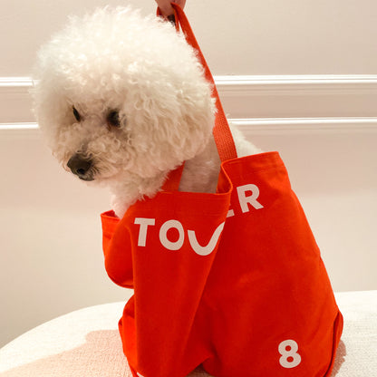 [Shared: The Tower 28 Beauty tote bag carrying a small dog inside]